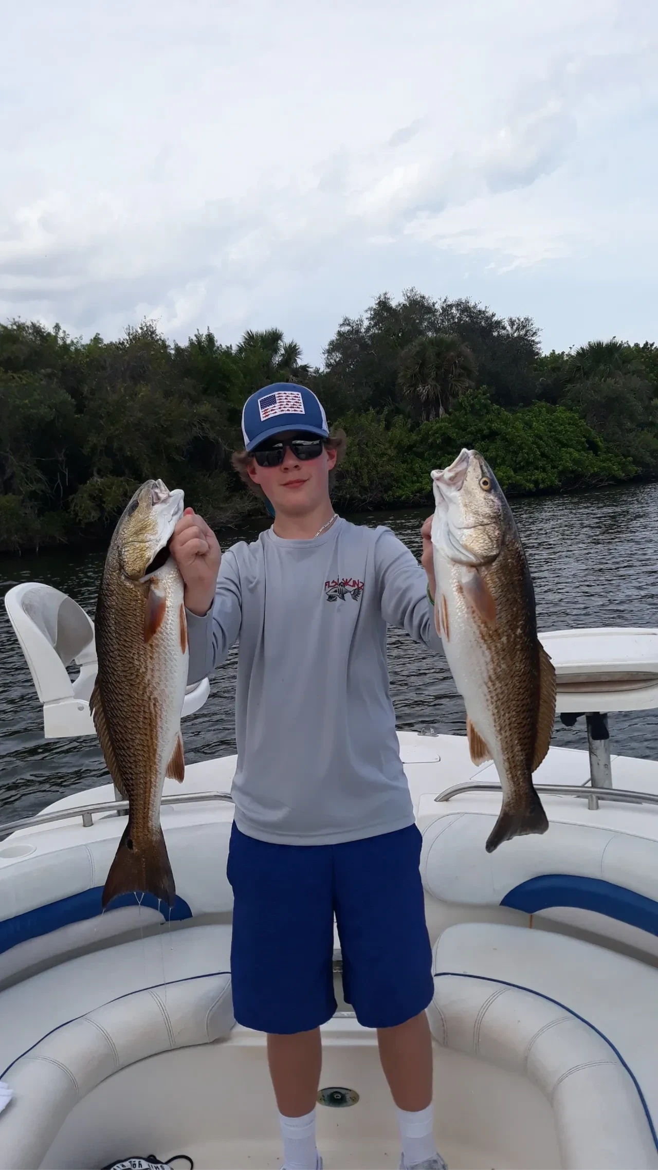 Kid fishing on a boat excited